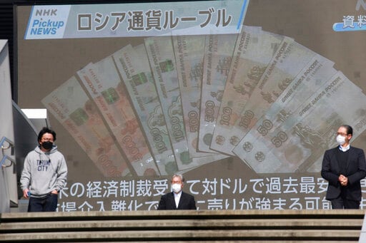 Russia Cuts Interest Rate as Ruble Settles Despite Sanctions