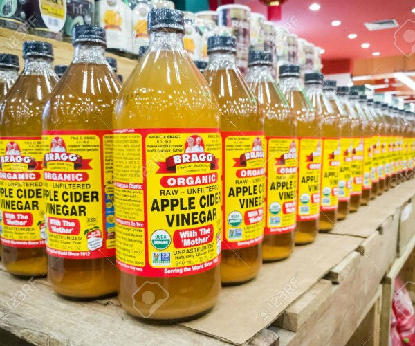 3 bottles of bragg's apple vinegar shown