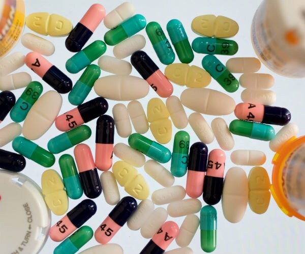different antibiotics are shown between pill bottles