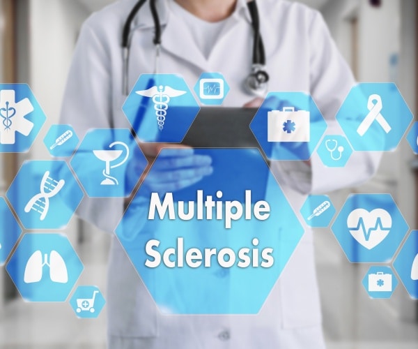 physician in front of screen that says 'multiple sclerosis' and images around it