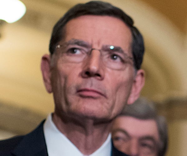 wyoming republican senator john barrasso looks to his left as he listens to a question outside the senate chambers