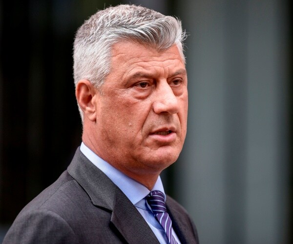 hasim thaci walks out of building