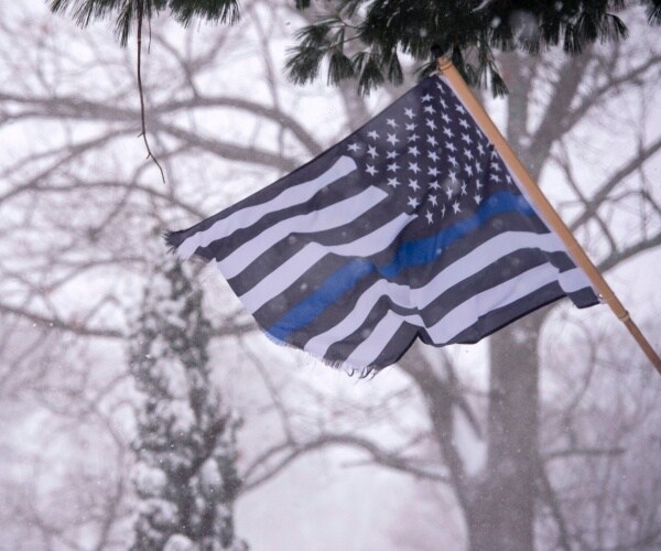 blue lives matter flag in snow