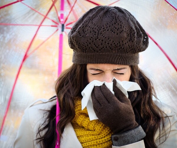 woman sneezing