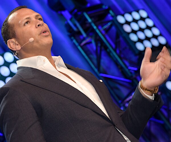 alex rodriguez wearing a headset speaks during a forum