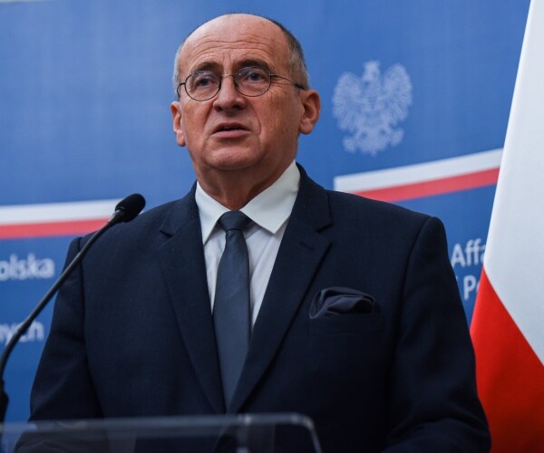 Zbigniew Rau speaks to the press