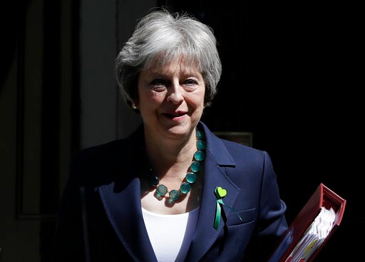 UK's May Defeats Brexit Rebels, but Divisions Still Reign