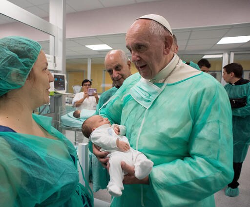 Pope Dons Scrubs to Visit Premature Babies at Rome Hospital