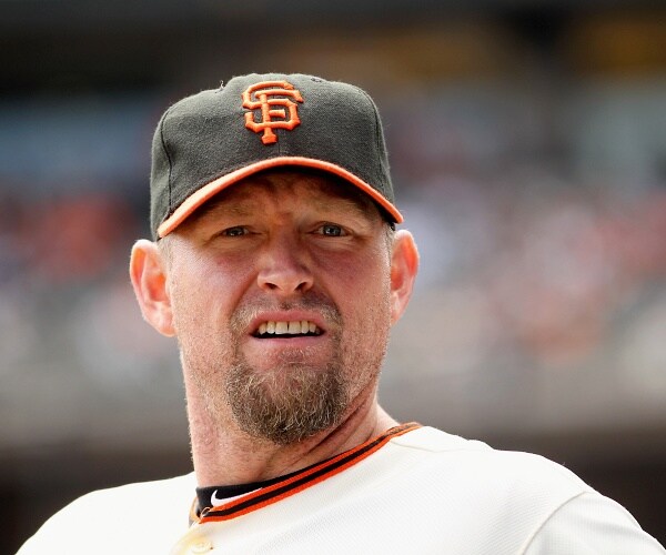 aubrey huff stands in dugout
