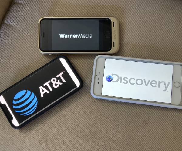 corporate logos photographed off of multiple apple devices
