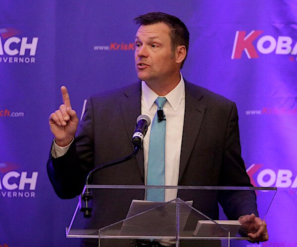 kris kobach gestures as he speaks during a campaign rally