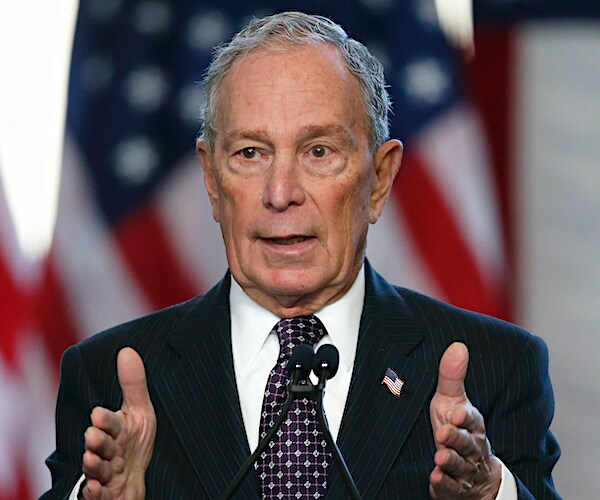 mike bloomberg gestures while speaking during a campaign rally