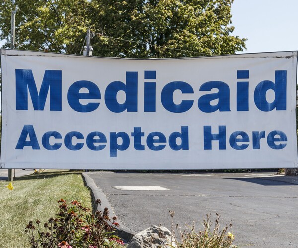 a sign saying medicaid accepted here