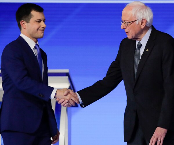 pete buttigieg and senator bernie sanders shake hands at the february 7 debate