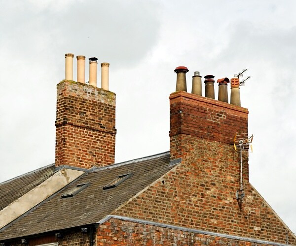 old rooftop with chimney pots