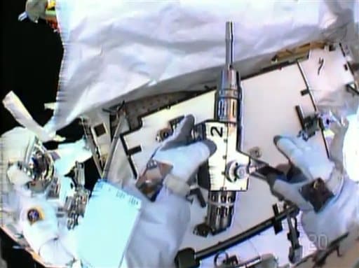 Spacewalking Astronauts Hunt for Big Station Leak