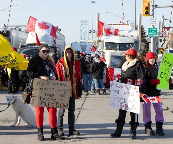 Protestors block traffic.