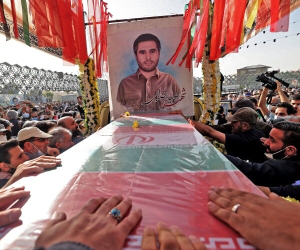 mourners gather at a funeral