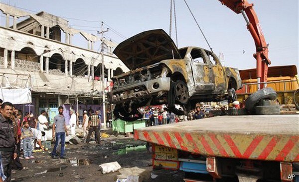 Attacks Kill 95 in Iraq; Hint of Syrian Spillover