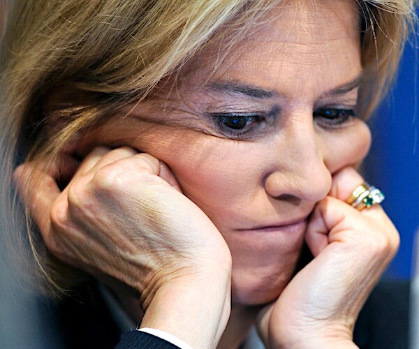 greta van susteren rests her face in the palms of both hands