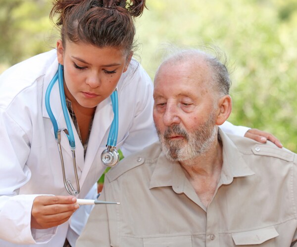 taking a patient's temperature