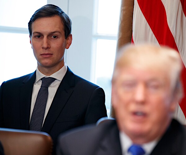 White House senior adviser Jared Kushner sits behind President Donald Trump in the cabinet room