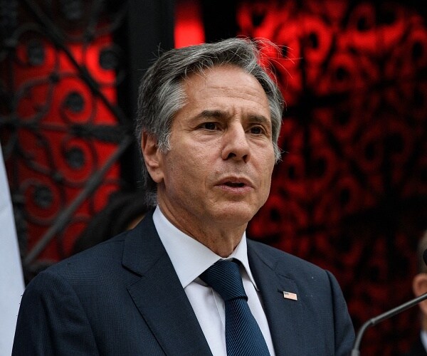 antony blinken speaks into mic