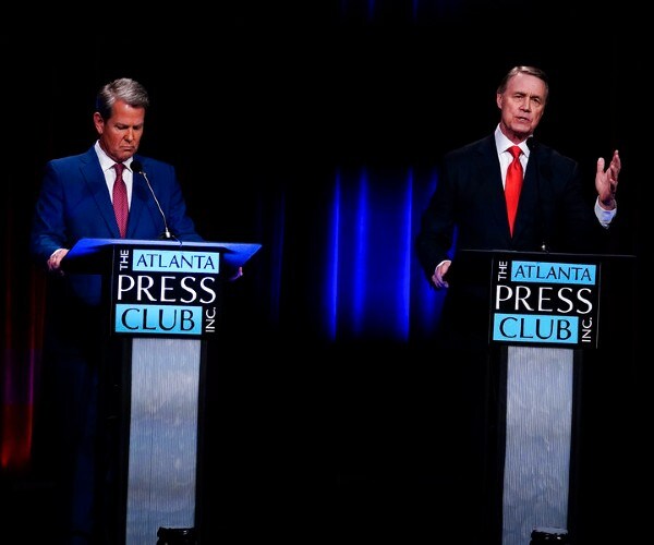 perdue and kemp at podiums