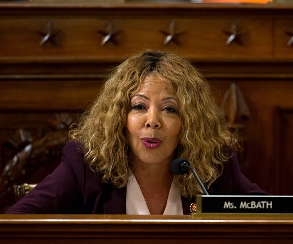 rep. lucy mcbath seated in a capitol hill hearing room