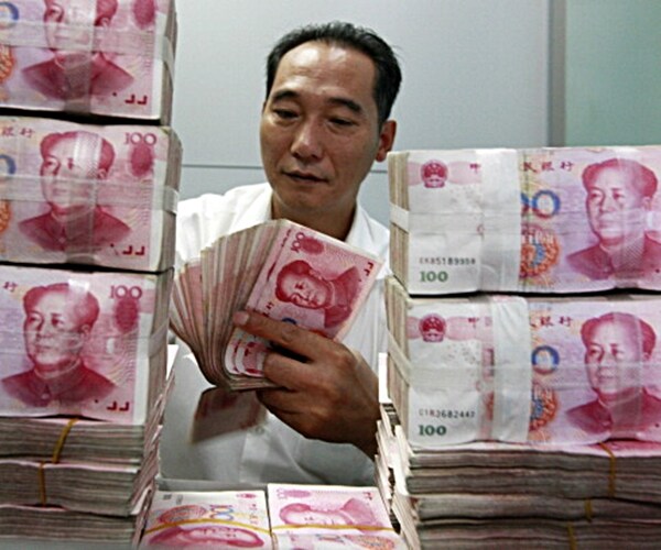 China Downgrade May Build Debt Mountain as Firms Borrow at Home