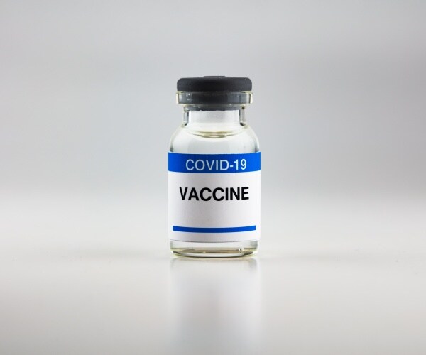 a vial of covid-19 vaccine without any brand on it
