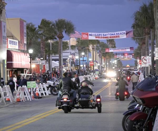 motorcycles cruising down a street