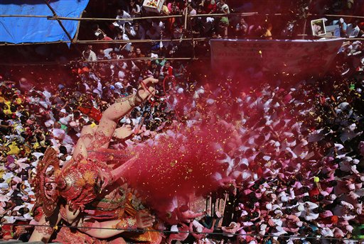 AP PHOTOS: Devout Hindus Celebrate the Birth of God Ganesha