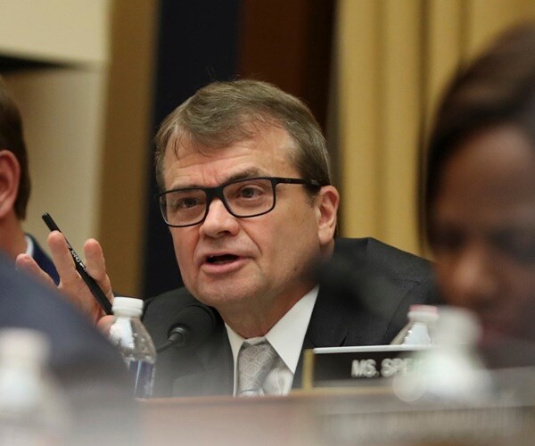 rep. mike quigley questions robert mueller at a house intel committee hearing