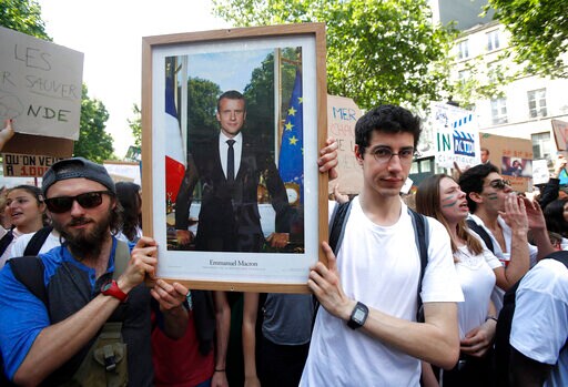 Climate Activists Convicted for Removing Macron Portrait