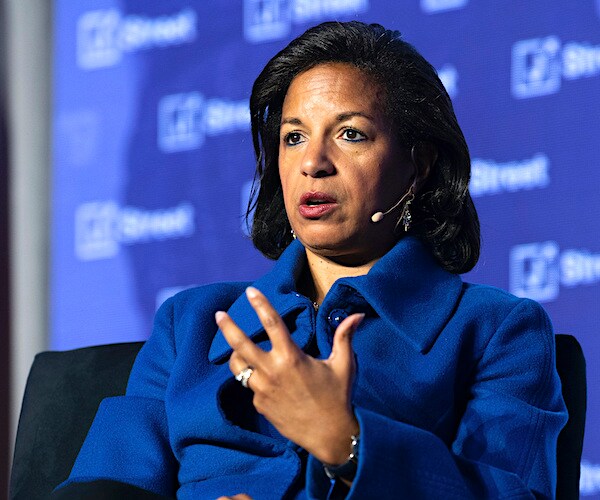 susan rice sits and speaks during a news conference