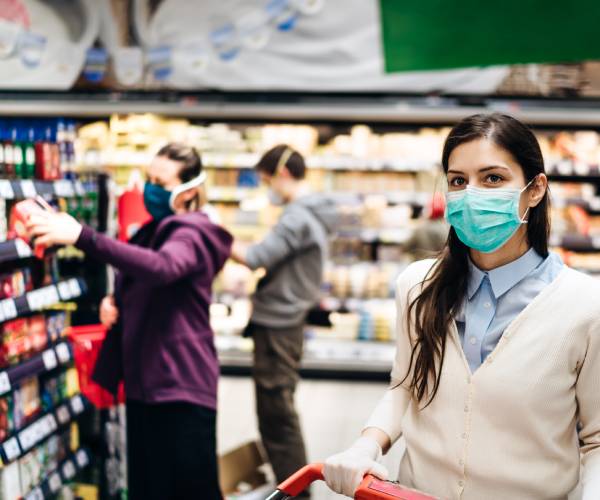shoppers wearing masks at a grocery store