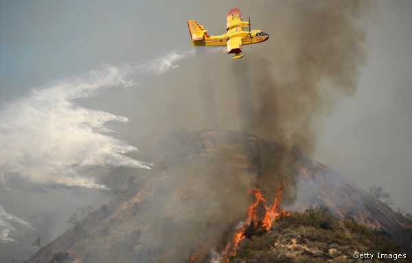 Wildfire Rages Near Los Angeles, Three in Custody