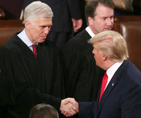 us supreme court justices neal gorsuch and brett kavanaugh with us president donald trump 