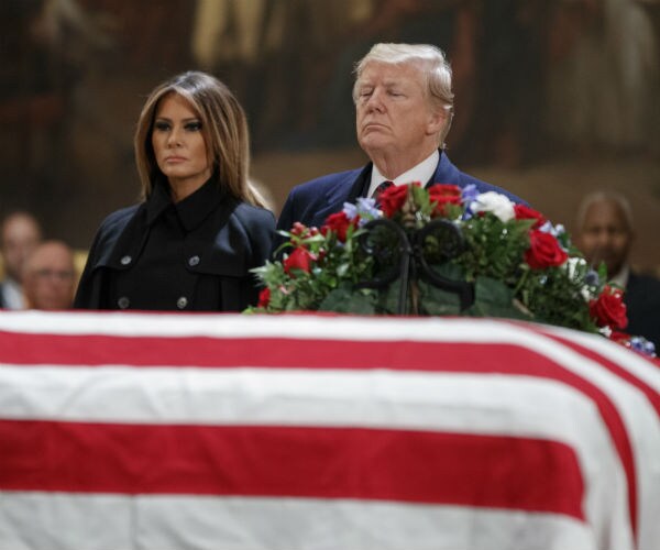 president donald trump and wife malania trump pay respects to former president george h.w. bush