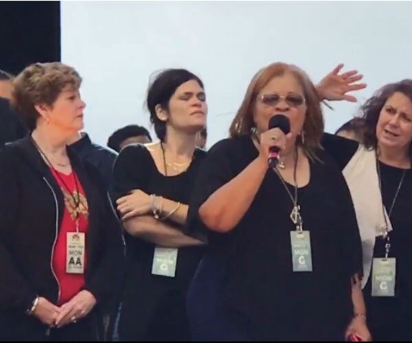 Women Rise Up on DC Mall Even as Rain Falls 