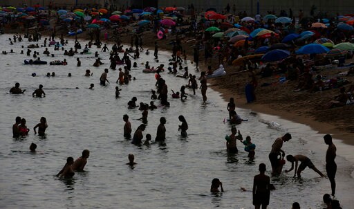 The Latest: French Minister: Nation Is Adapting to High Heat