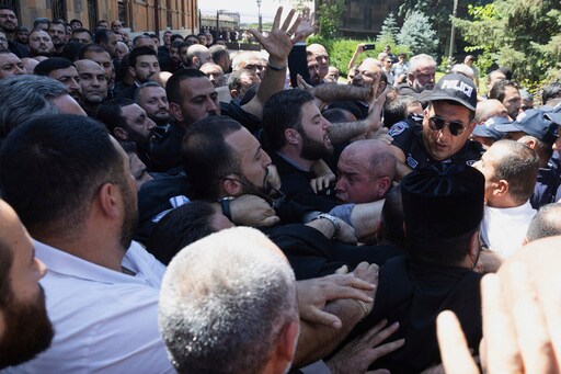 Crowds Block Armenian Security Forces from Arresting a Clergyman Who Has Criticized the Government