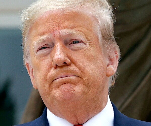 president donald trump grimaces during public appearance