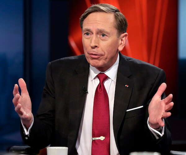 david petraeus gestures with both hands during a television appearance