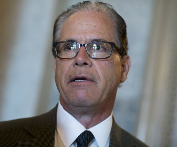 mike braun stands and speaks to the media during a news conference