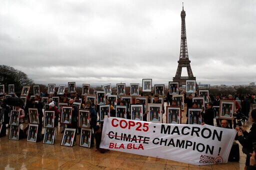 French Activists Use Macron Portraits to Urge Climate Action