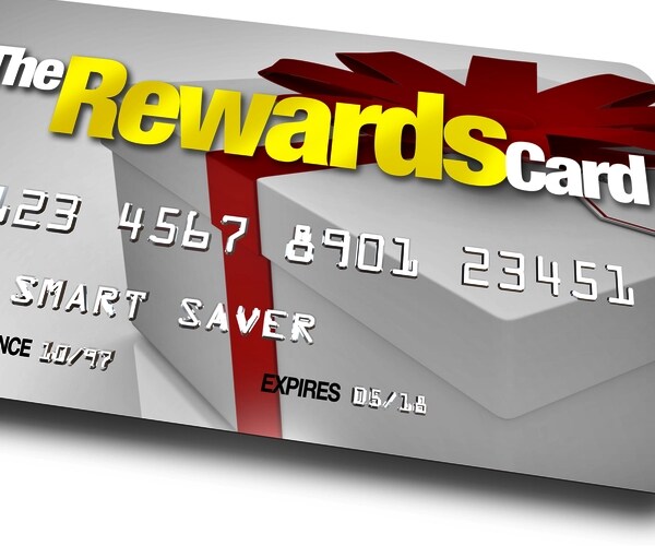 credit card with the name The Rewards Card and a present shown on it illustrating the benefits, refunds and rebates 