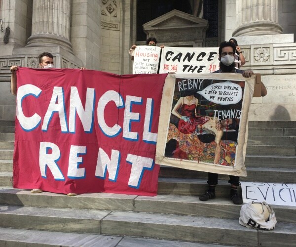 protesters with cancel rent sign