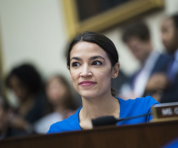 rep alexandria ocasio-cortez is shown on capitol hill